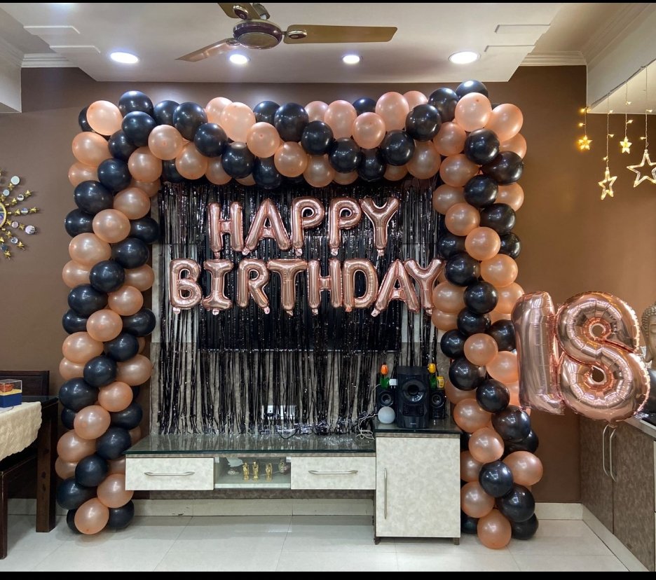 Premium adult birthday decoration featuring a black and rose gold organic balloon arch, black fringe backdrop, rose gold Happy Birthday foil letters and custom age number. This elegant adult birthday party decoration is perfect for birthday celebrations, milestone birthdays and surprise parties at home, hotels and party venues. Birthday party decoration in Delhi, Uttam Nagar and nearby areas, with balloon colours, name, age number and theme fully customizable as per your choice.