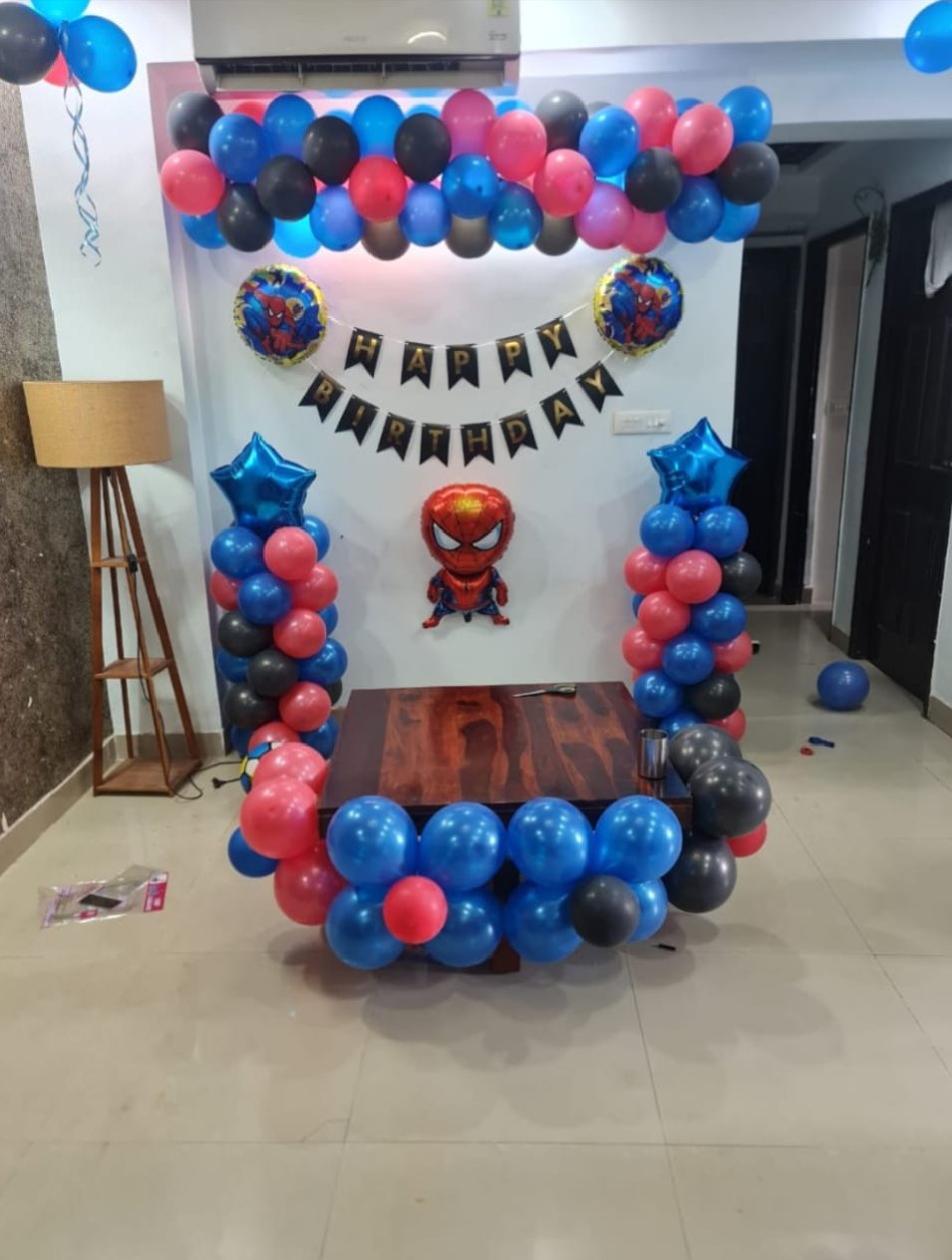 Surprise birthday room decoration with red and white balloons, ceiling balloon decoration, Happy Birthday foil letters, heart-shaped balloons, floor balloon arrangement and a beautiful rose petal pathway. This red and white birthday decoration is perfect for surprise birthday parties, romantic celebrations and home room decoration. Get customized balloon decoration according to your choice of colours, theme, name and age number. Balloon decoration near me and birthday party decoration services available across Delhi NCR, including Uttam Nagar, Janakpuri, Dwarka, Vikaspuri, Paschim Vihar, Nangloi, Palam, Rajouri Garden and Punjabi Bagh.